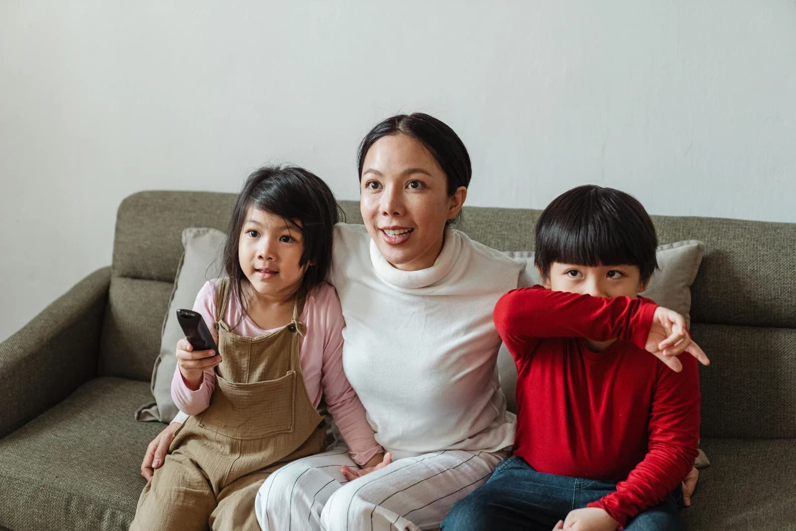 Mother and two children spending time together at home